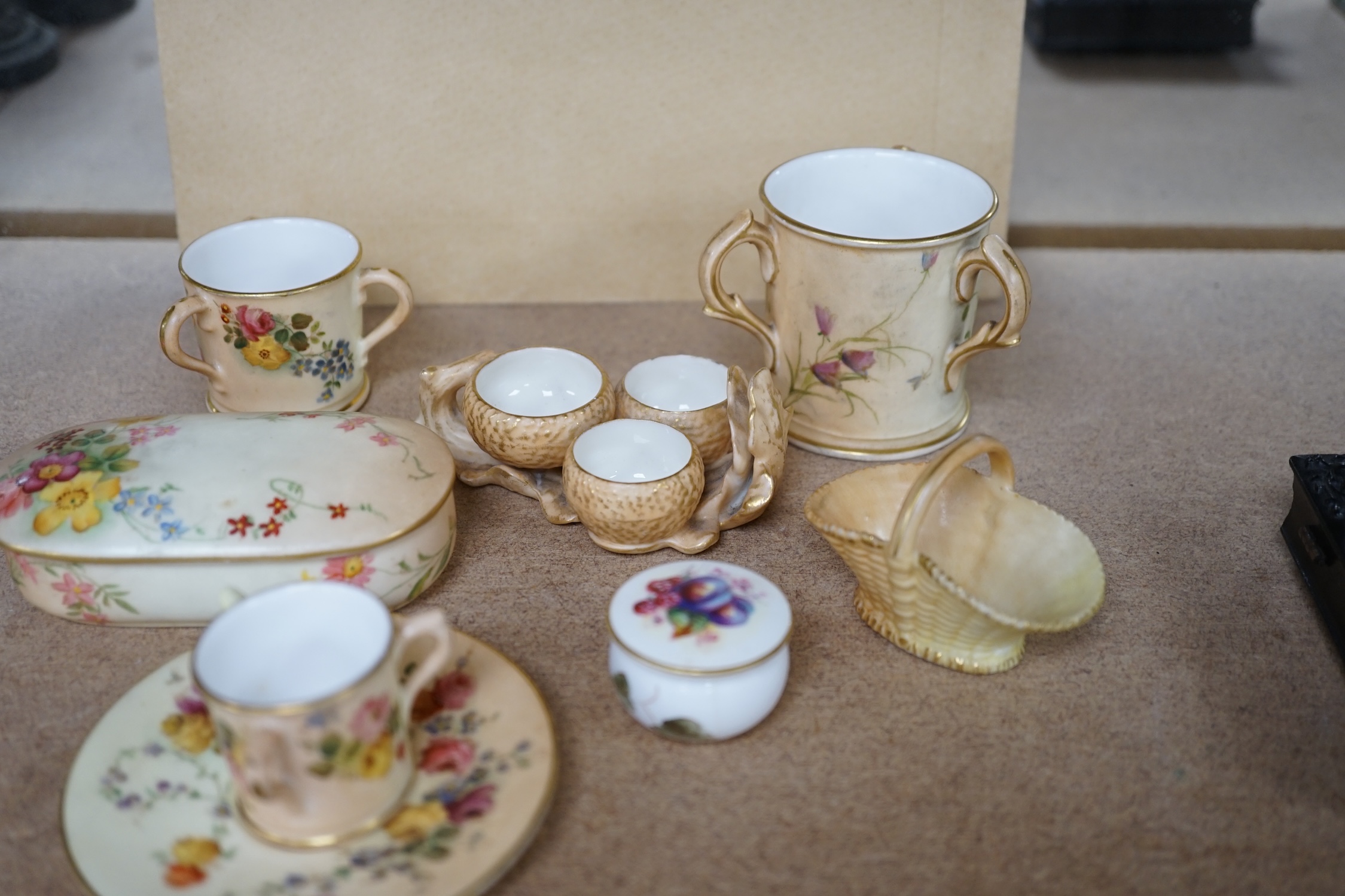 A group of Royal Worcester etc. miniatures including blush ivory tygs and a miniature fruit painted pot and cover, largest 6cm high (8). Condition - mostly fair